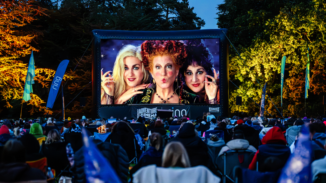 Three witches from Hocus Pocus projected on an outdoor cinema