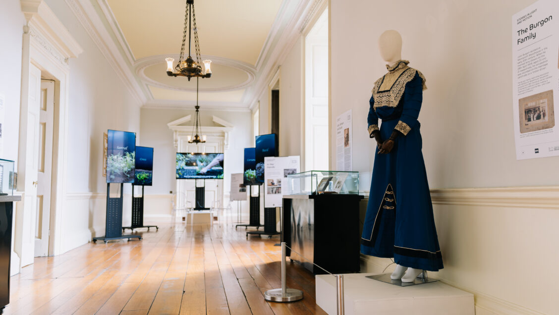 A beautiful blue period wedding dress on display in the gallery